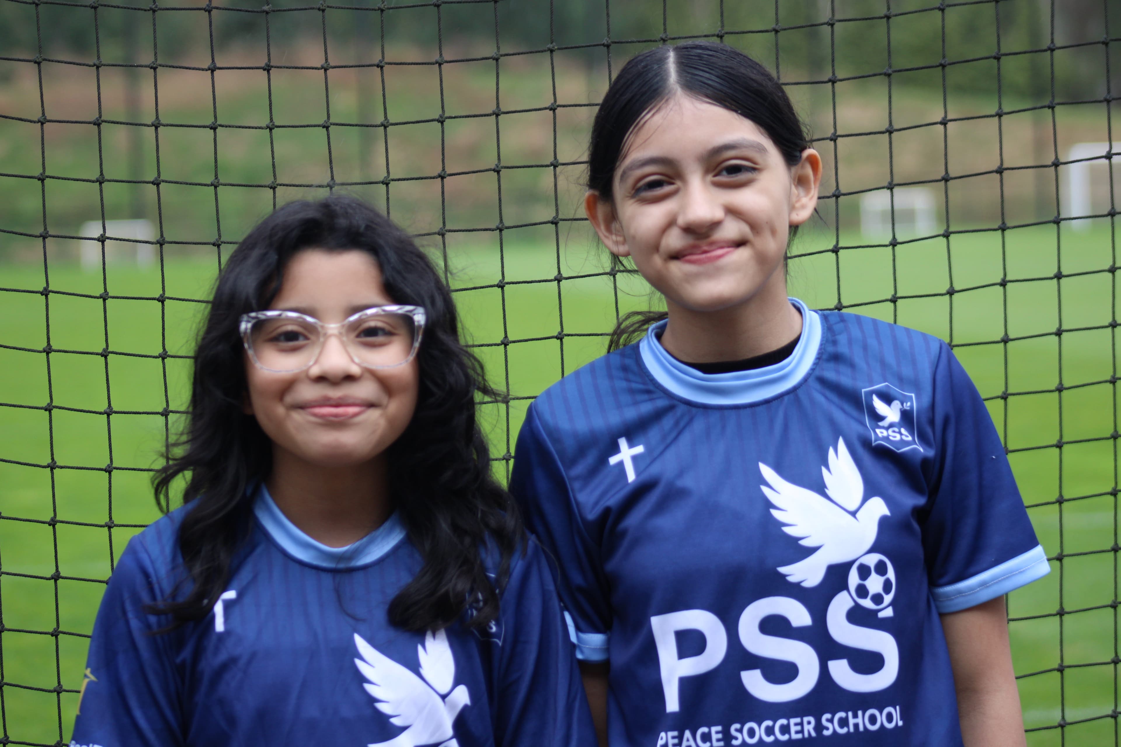 Peace Soccer School player receiving award at youth soccer academy