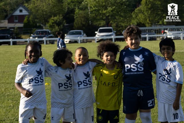 Peace Soccer School team community and family