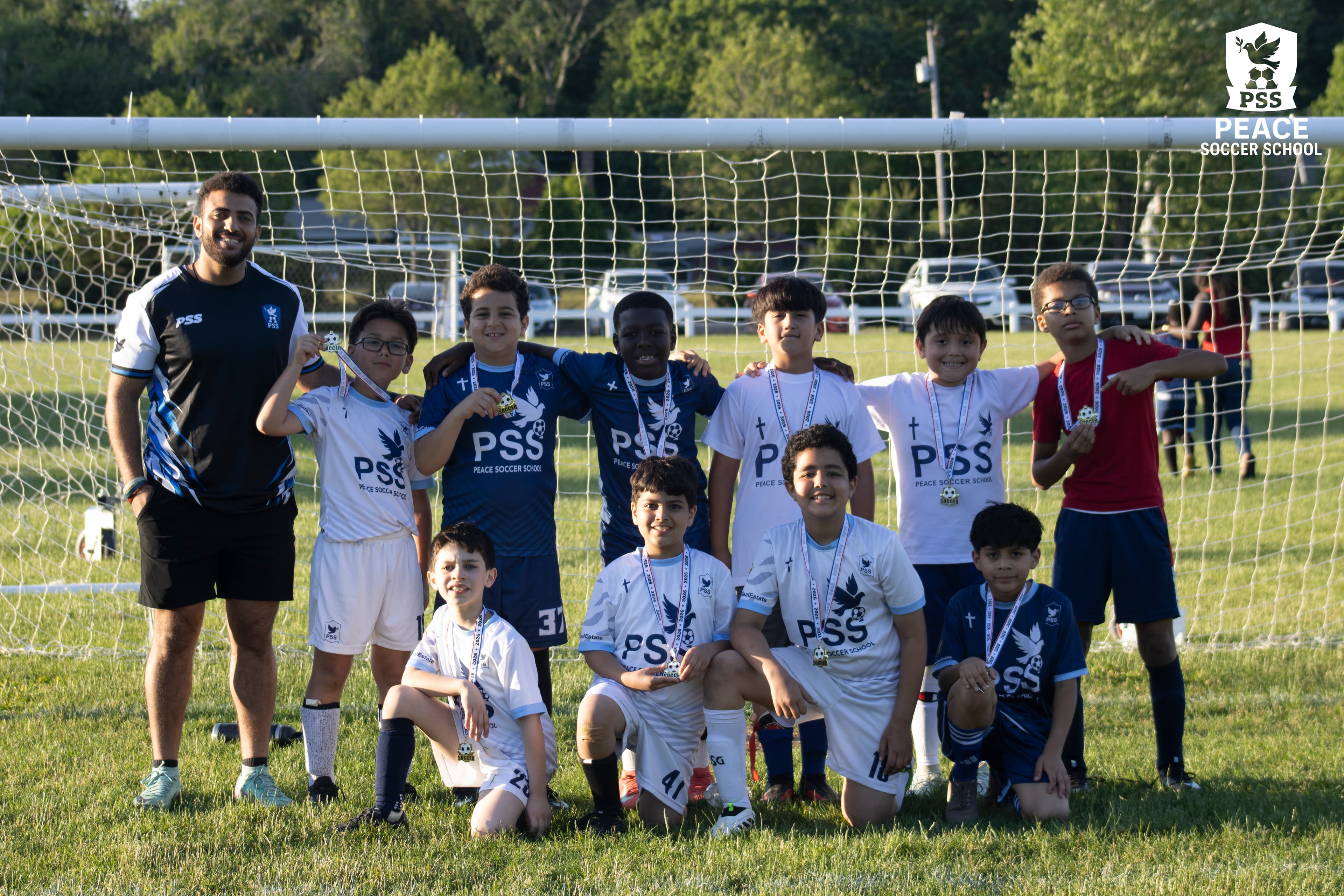 Peace Soccer School coach training players