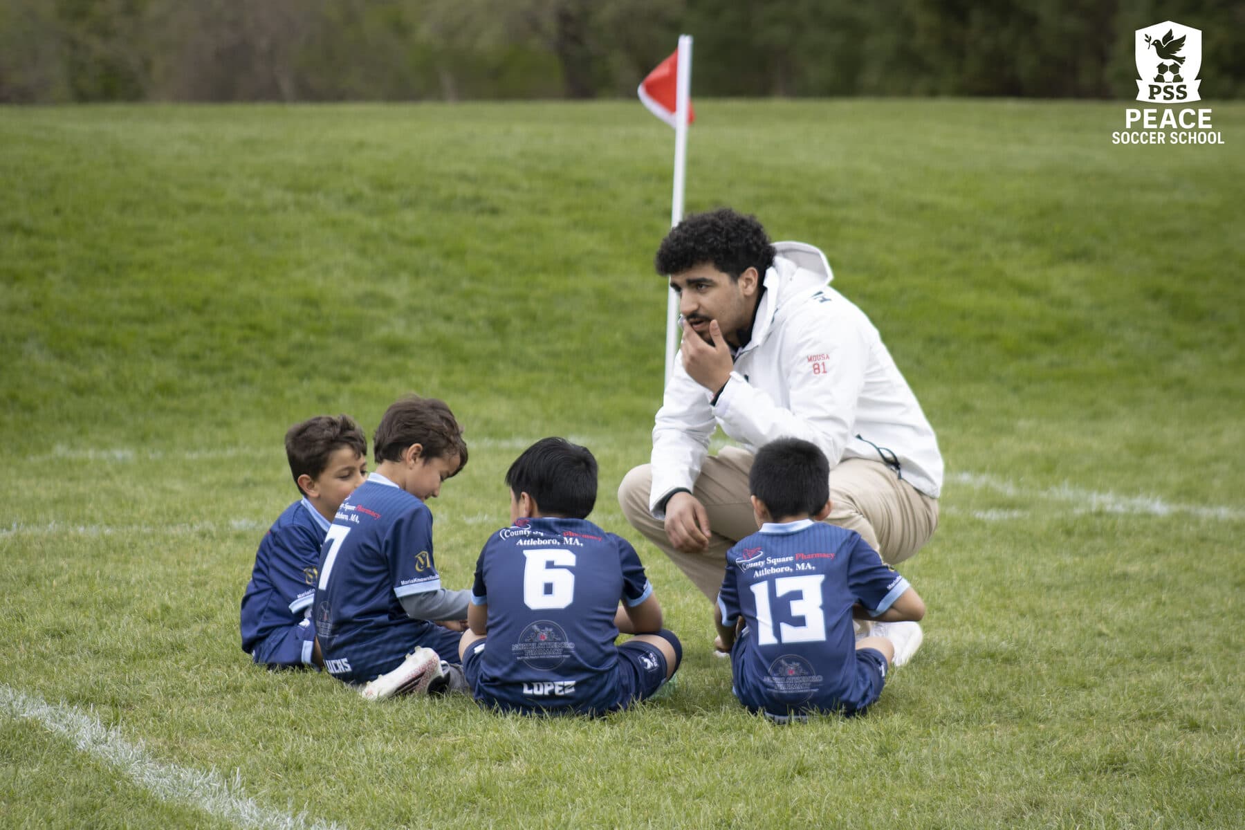PSS coach mentoring young player