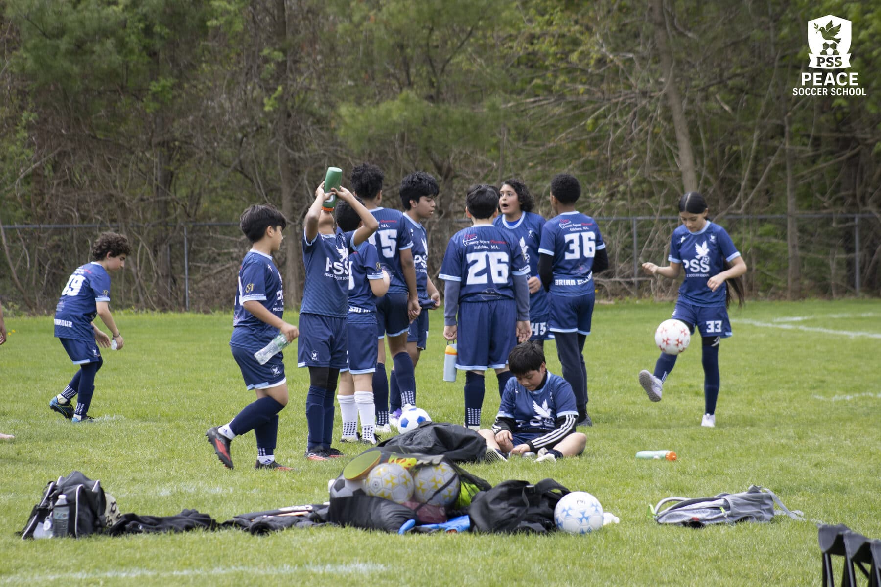 Peace Soccer School team huddle - next season tryouts