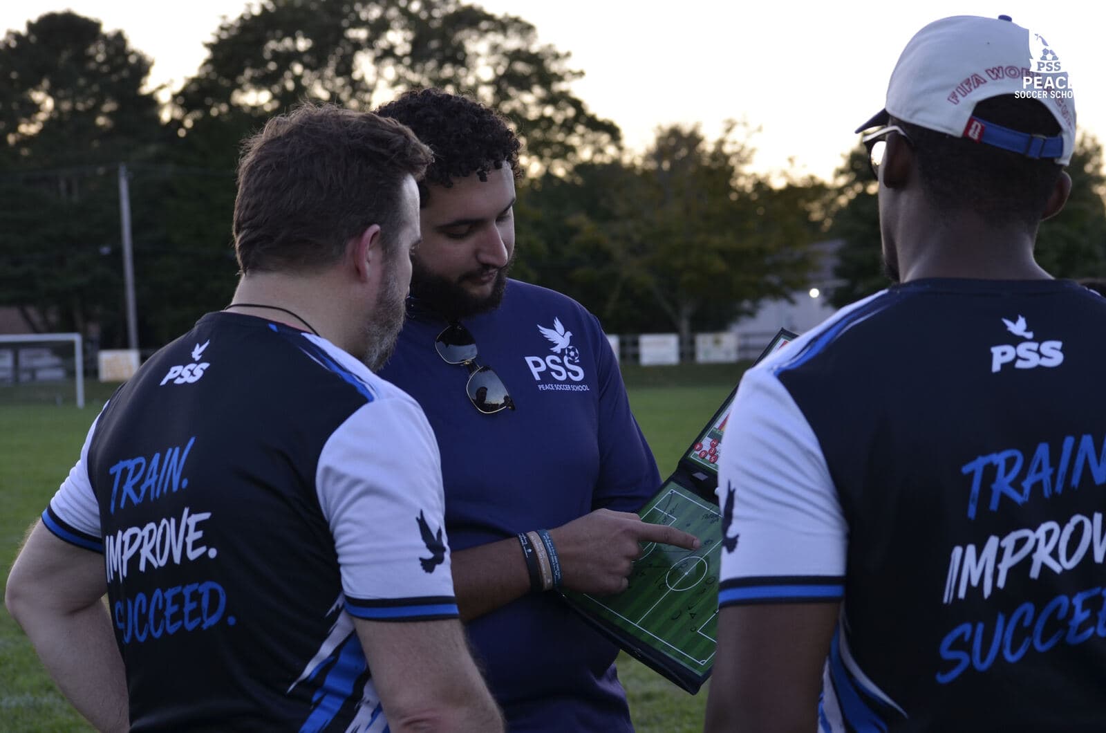 A PSS coach with a clipboard at tryouts