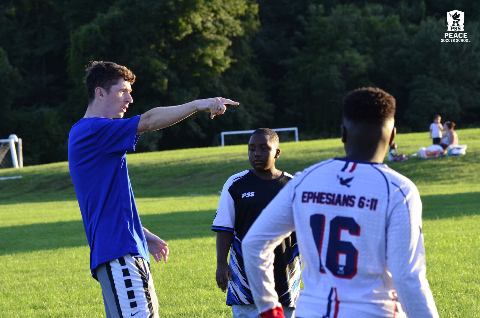 A PSS coach showing players a drill