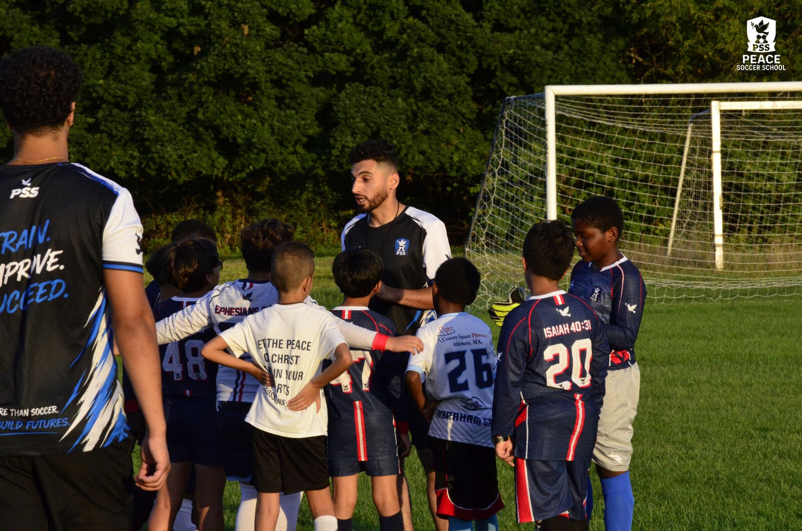 A PSS team huddled with their coach